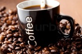 2478217-mug-of-black-coffee-with-coffee-beans